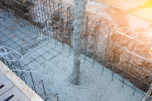 Pouring concrete in construction site
