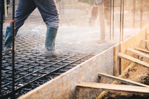 Concrete pouring during commercial concreting floors of buildings in construction - concrete slab